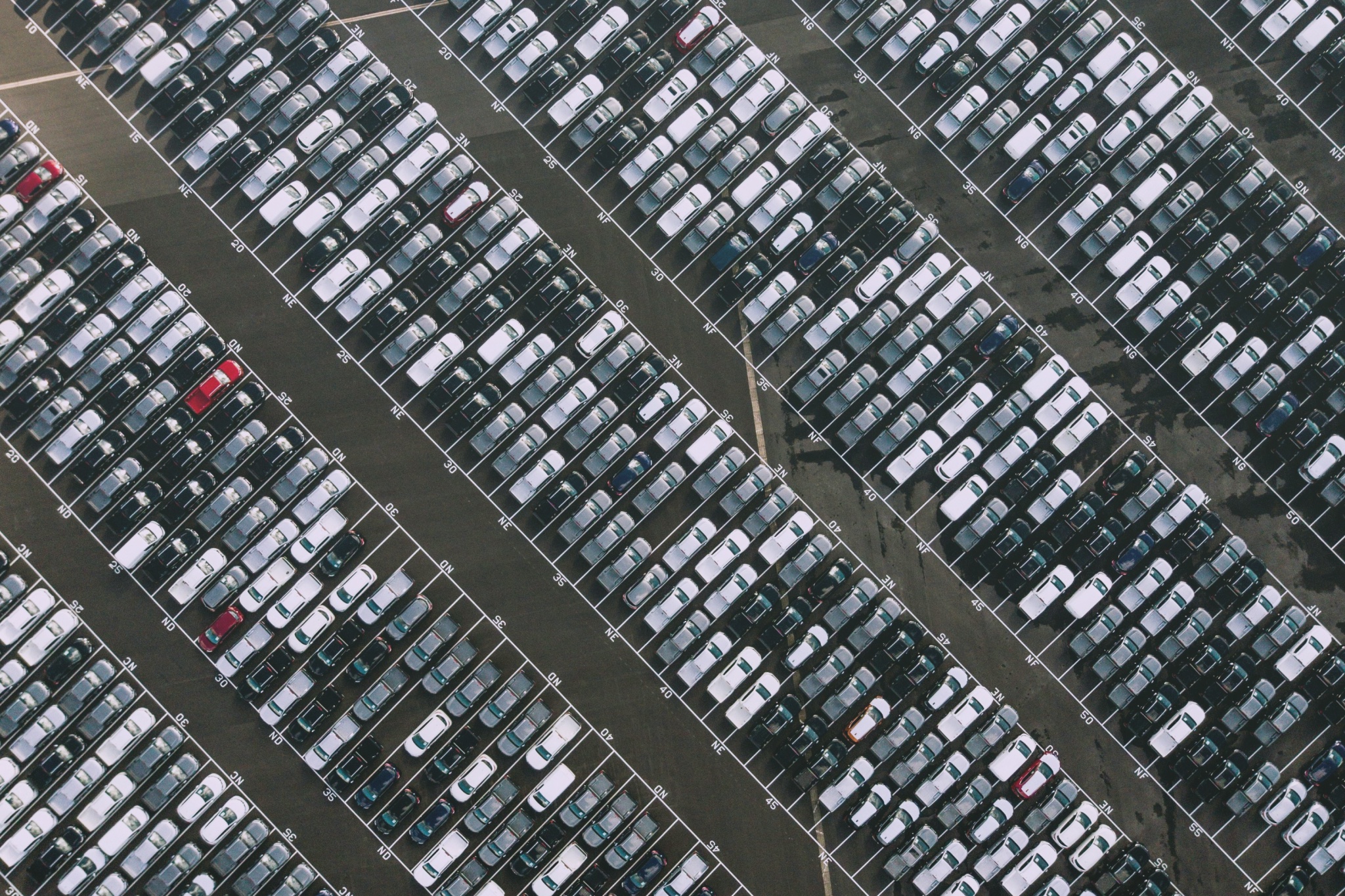 Aerial view of a large, dense parking lot symbolizing ZeroTier's capability for managing vast Smart City and IoT deployments.